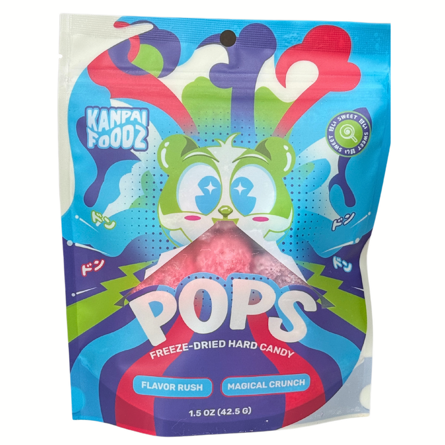 Front of the bag of freeze-dried hard candy called 'Pops' made by Kanpai Foodz, featuring a vibrant blue and green design with a happy cartoon panda illustration and the text 'Pops' prominently displayed. The packaging highlights the flavor rush and magical crunch of the product.