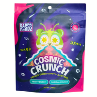 Front of the bag of freeze-dried gummy clusters candy called 'Cosmic Crunch' made by Kanpai Foodz, featuring a vibrant space-themed design with a green alien illustration and the text 'Cosmic Crunch' prominently displayed. The packaging highlights the fruity burst and magical crunch of the product.